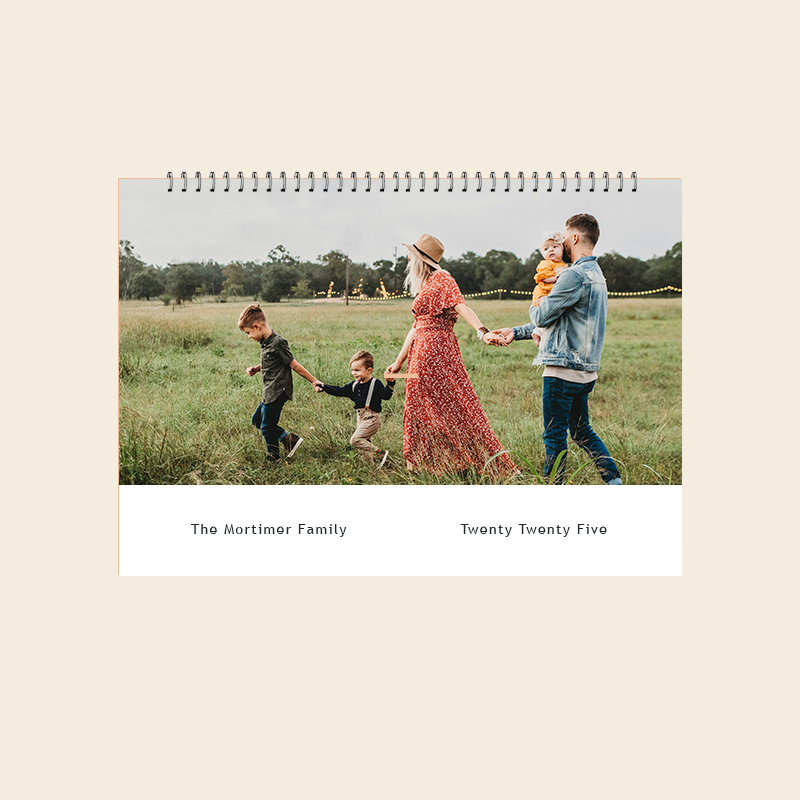 Personalised wall calendar cover featuring a family photograph