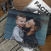 Lifestyle image of an A4 landscape hardcover personalised photo book printed in the UK using FSC-certified paper
