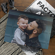 Lifestyle image of an A4 landscape softcover personalised photo book printed in the UK using FSC-certified paper