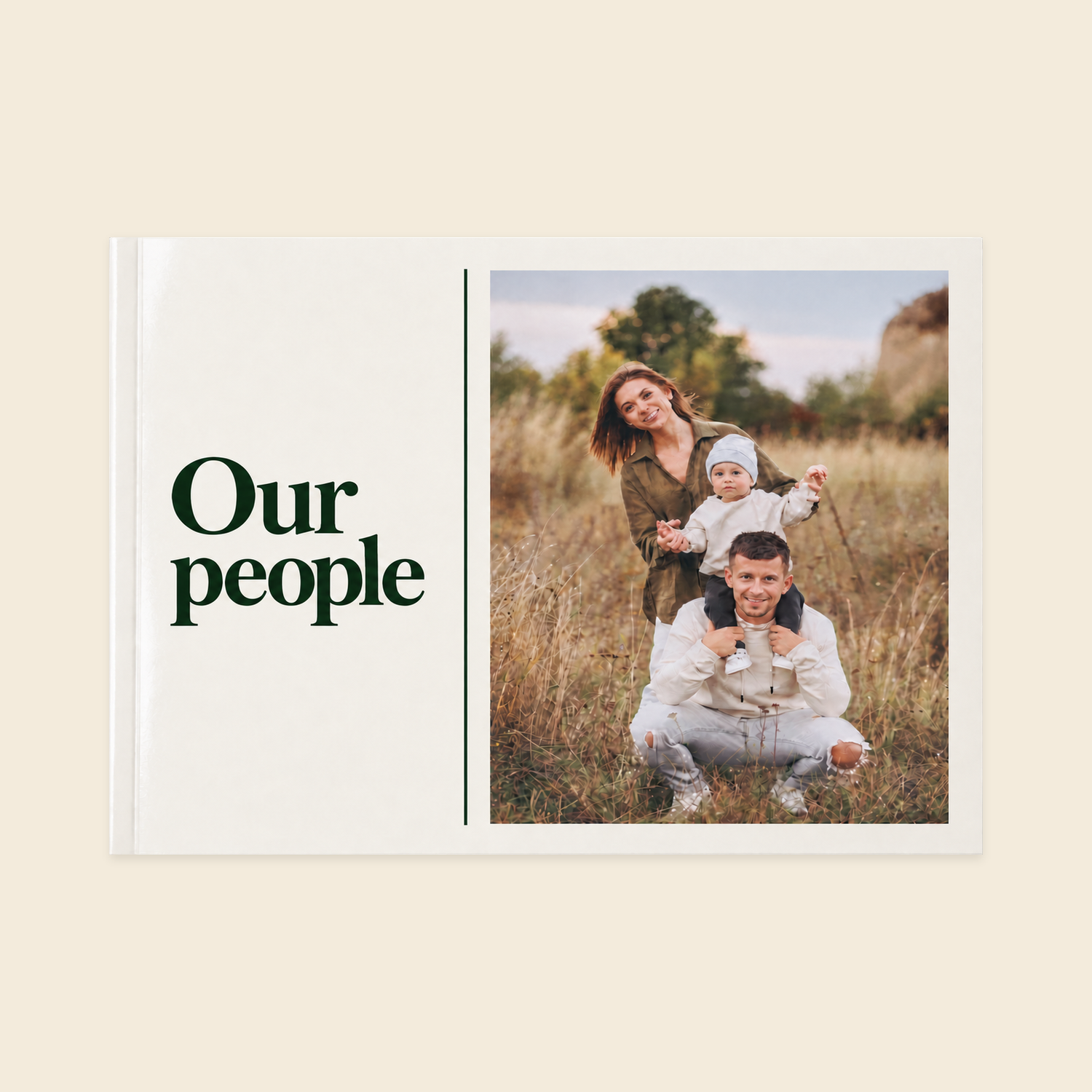 A4 landscape softcover photo book with recycled inner pages, a vertically centred Our People title, green divider and family meadow photograph.