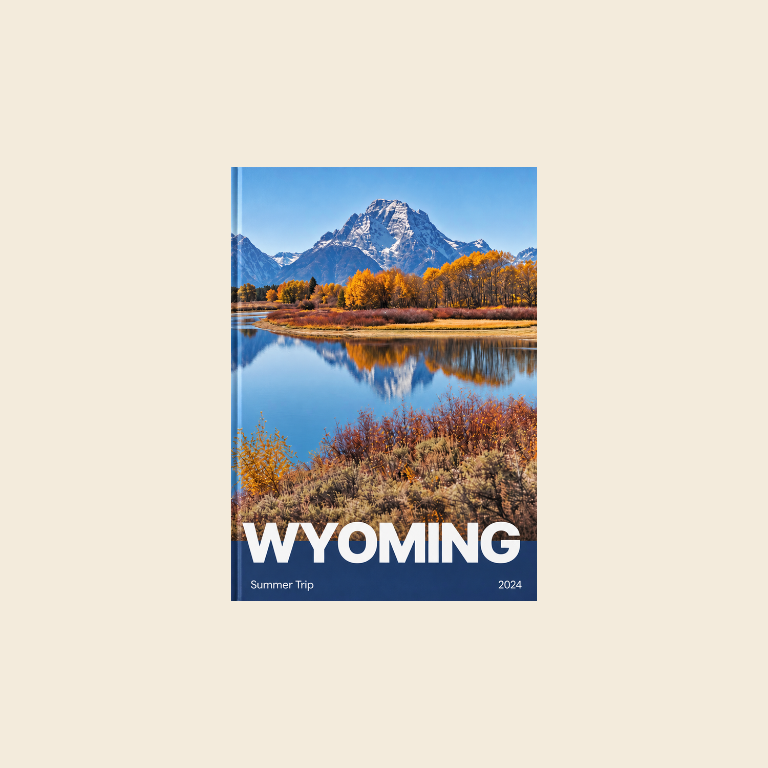 Picsme A5 portrait hardcover photo book with gloss paper, showing mountains and a lake on the Wyoming cover.