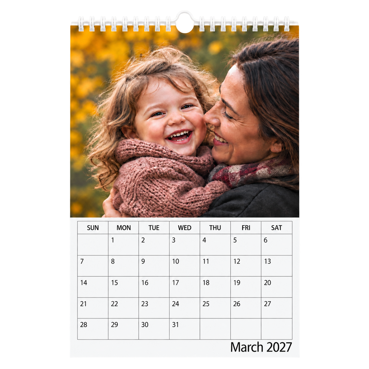 Picsme A5 single-page photo calendar showing a mother and laughing young daughter and the March 2027 date grid with white Wire-O binding and a white hanger.